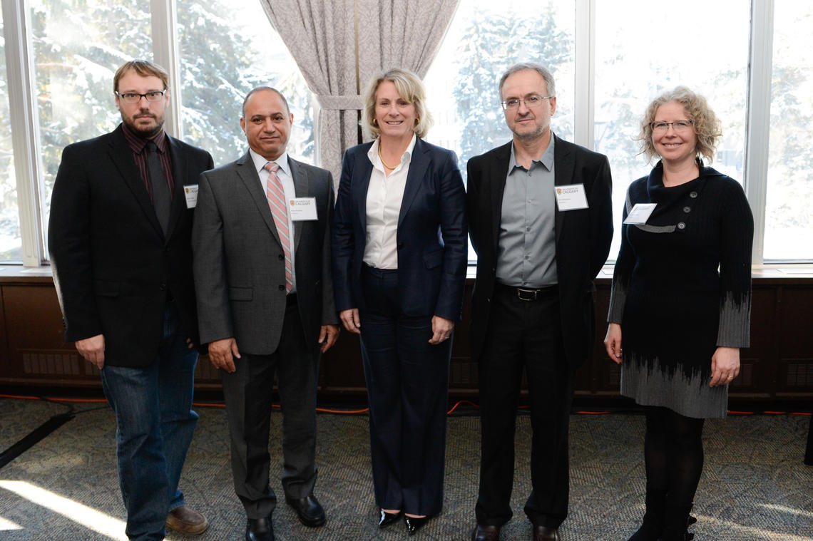 University of Calgary President Elizabeth Cannon, centre, with four of the 21 scholars whose accomplishments were recognized on Friday. From left: Simon Trudel, Naser El-Sheimy, Pedro Santamaria, and Rebecca Sullivan.