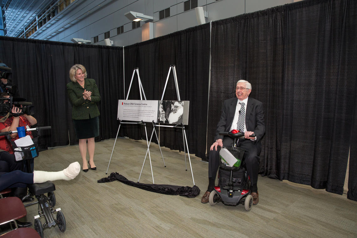 University of Calgary President Elizabeth Cannon and donor Dave Robson unveil a plaque on Tuesday for the newly created Robson DNA Science Centre.