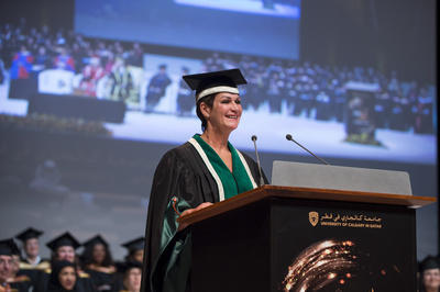 Kim Critchley, dean and CEO of UCQ, addresses the new graduates, professors, family, friends and dignitaries from Qatar's health and education spheres at the University of Calgary in Qatar convocation ceremonies.
