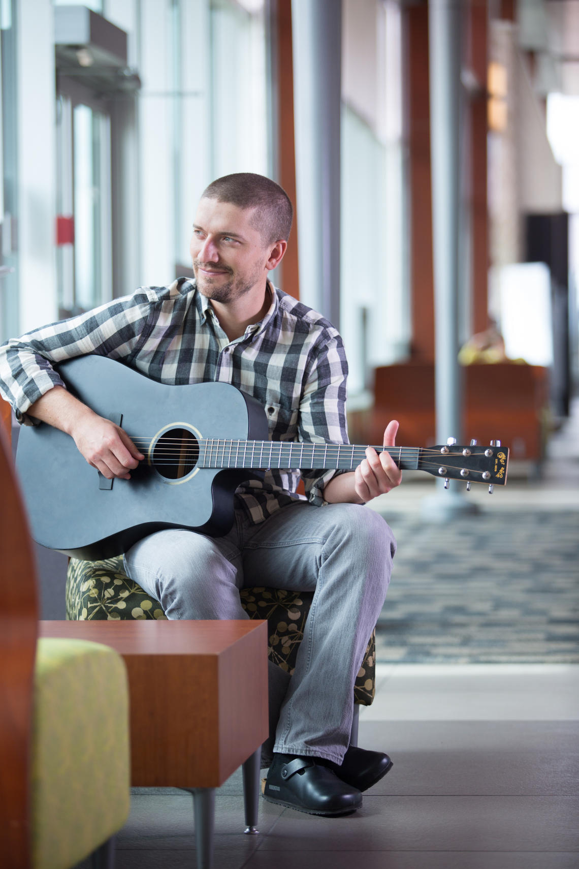 Renaissance man Dustin Anderson — who plays guitar with a med school band — graduates this spring with a PhD and an MD from the university's Leaders in Medicine program.