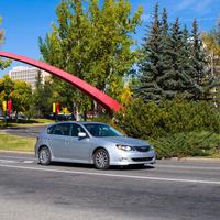 Universit of Calgary main campus, arch, car driving in motion