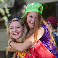 two UCalgary students in front of residence.