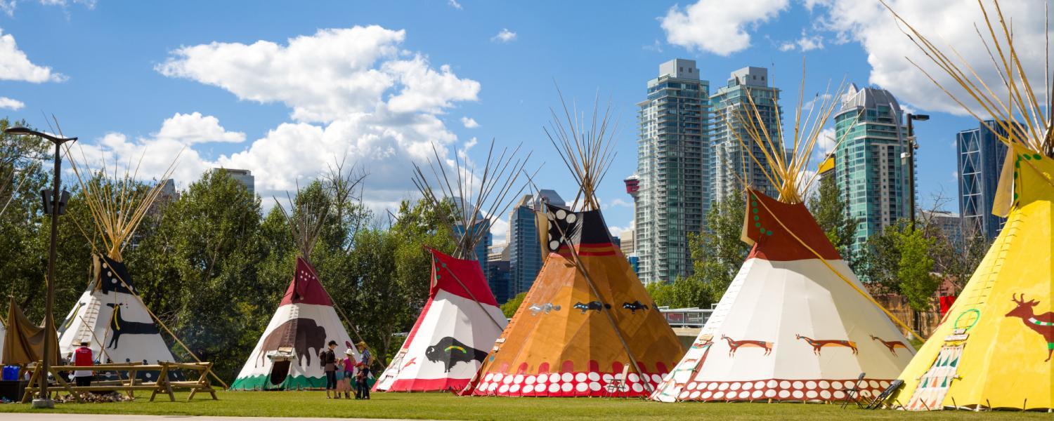 A variety of tipis displayed in the 2018 Stampede Indian Village