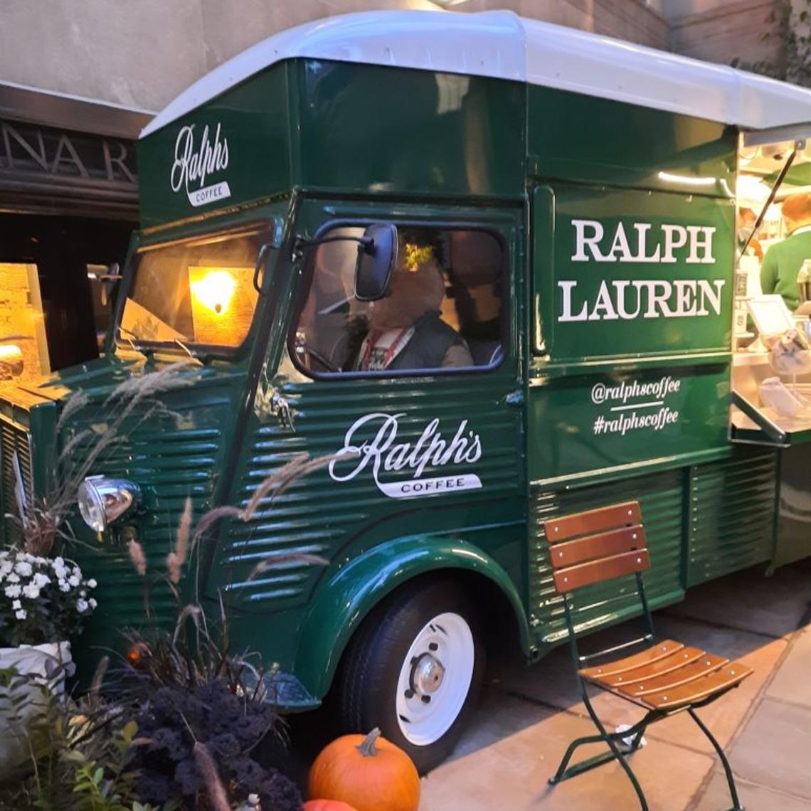 green Ralph Lauren food truck with cafe chair and pumpkins in front of it