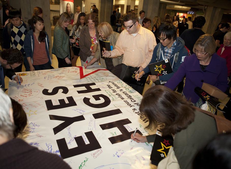 Guests are invited to write their thoughts on the Eyes High banner.