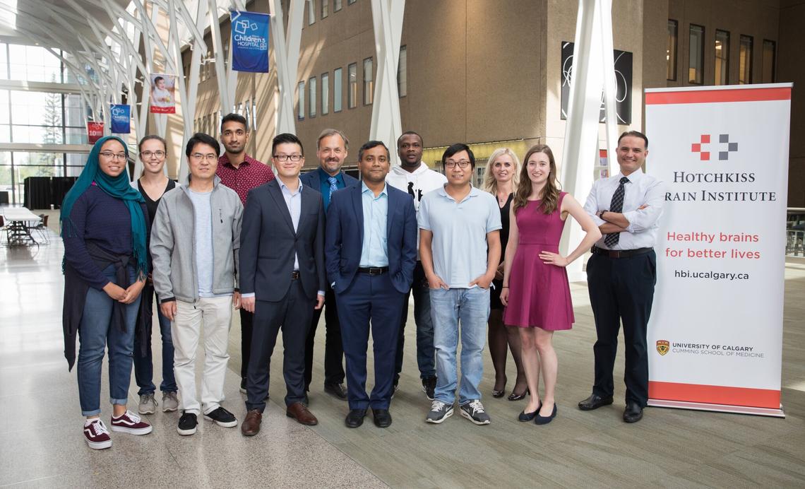 Dr. Bijoy Menon, MD (front row, centre), Dr. Andrew Demchuk, MD (back row, centre), and Dr. Mohammed Almekhlafi, MD (far right); with fellows, researchers and trainees.