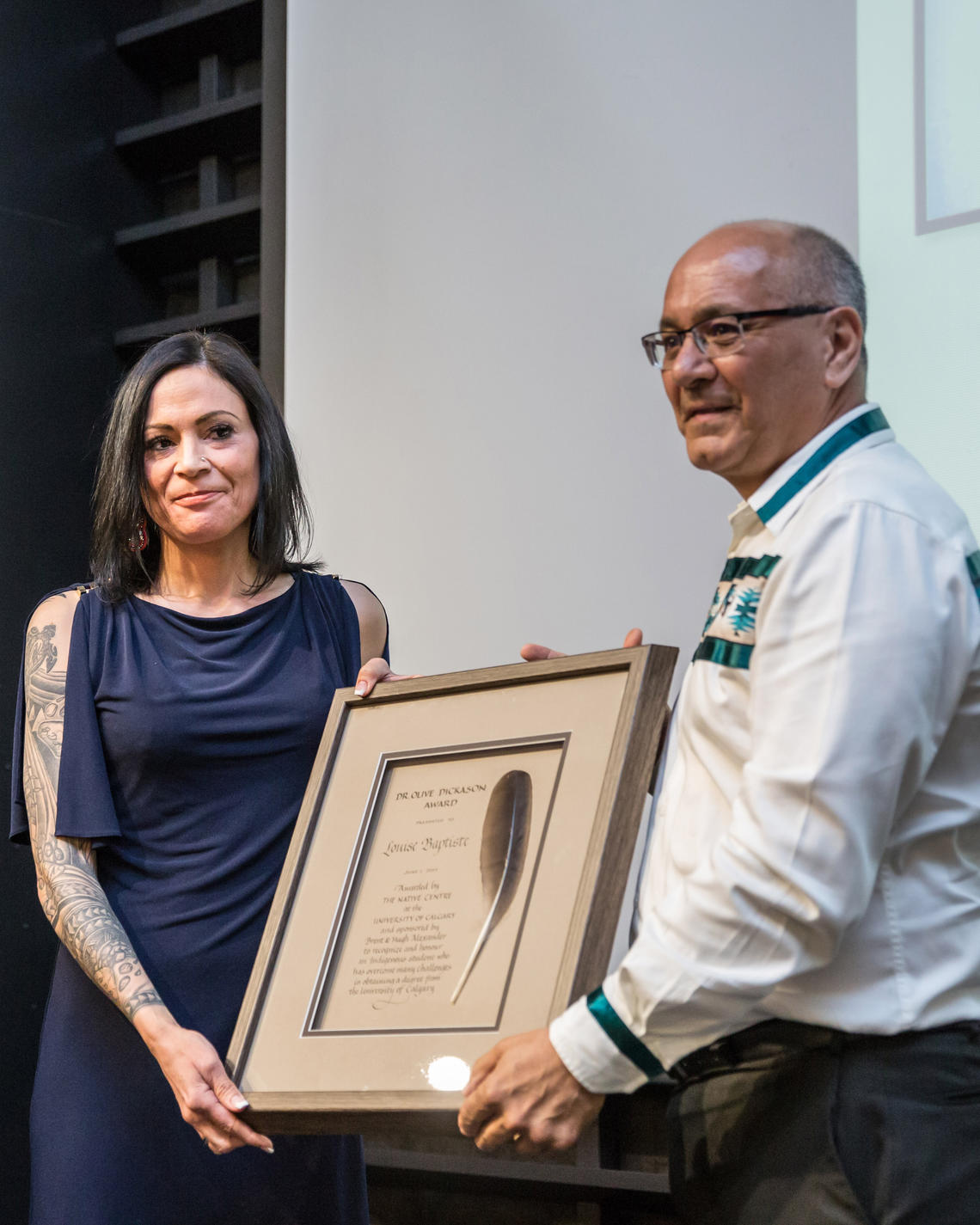 Louise Baptiste receiving the Dr. Olive Dickason Award from Dr. Michael Hart, Vice-Provost (Indigenous Engagement)