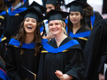 UCalgary grads smiling 