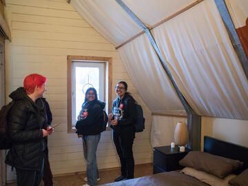 Incoming students visiting the Spo’pi House, a solar house intended to provide alternative housing