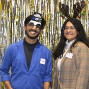 Students post in a festive photo booth. 