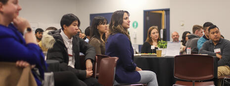 Students listen to panel discussion