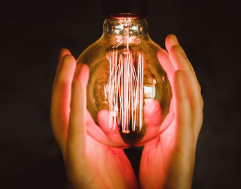 Light bulb in hands