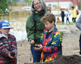 Children playing with soil at Highfield Regenerative Farm