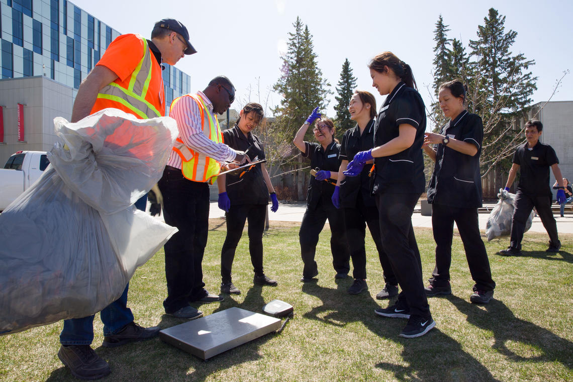 Campus Cleanup volunteers weigh in to see who collected the most litter on April 27.