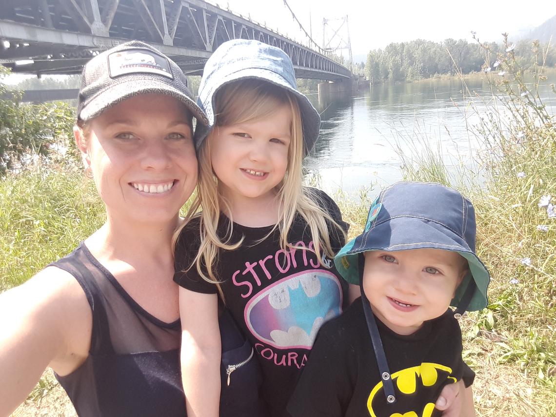 Lana Clyde plays with her two children during a park outing. The Calgary mother experienced postpartum depression a year ago and urges all moms with similar experiences to avoid feeling shame and not to be afraid to seek help.