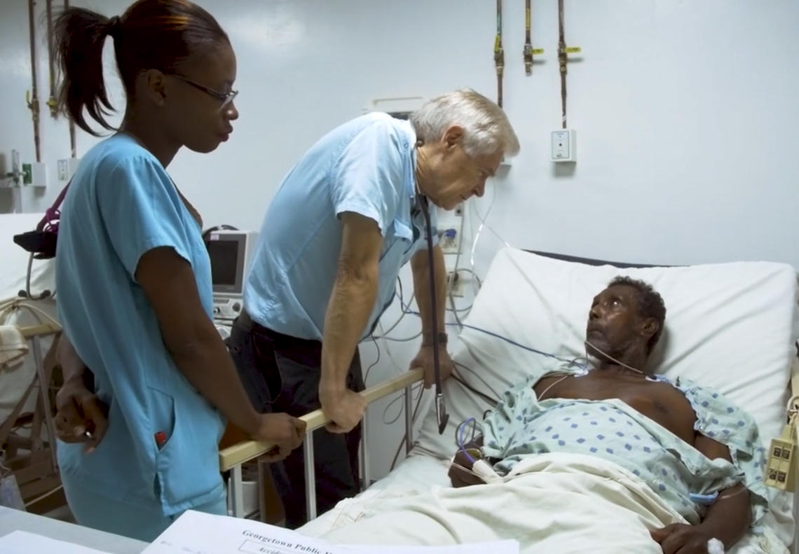 Dr. Wayne Warnica speaks to a Guyanese patient. 