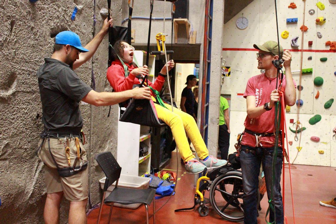 The harness helps campers in wheelchairs pull themselves up with their arms.