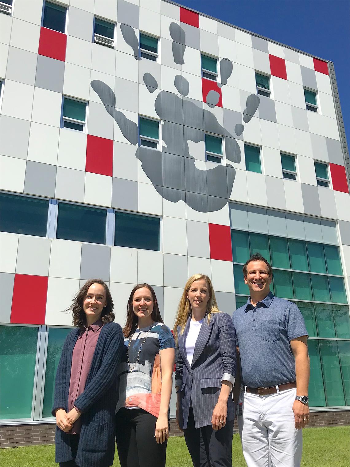 Rachel Eirich, far left, values being a part of a collaborative project, where the goal is to better the lives of children who have endured trauma. With her, from left: Nicole Racine, Sheri Madigan, and Daniel Garfinkle.