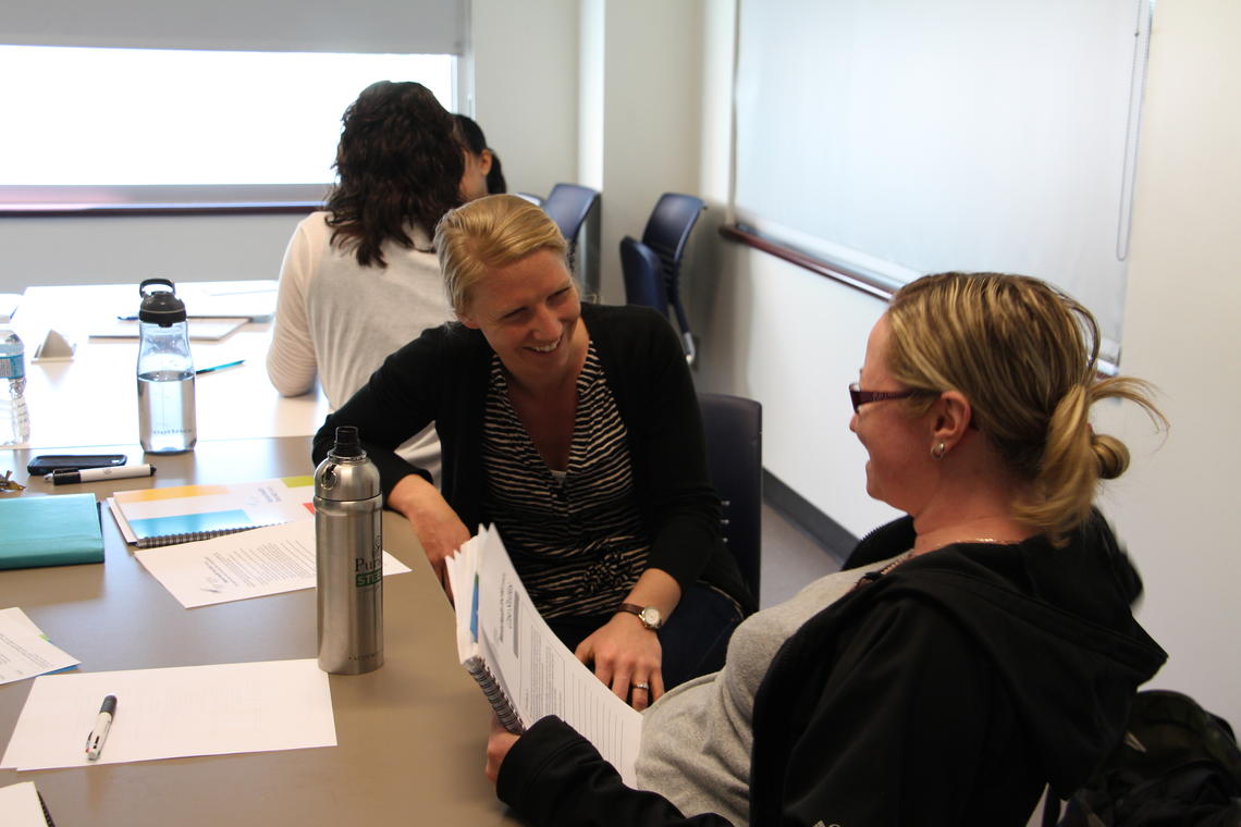 University of Calgary Master of Social Work student Tiffany Talen, left, participates in scenario dialogue with a colleague in the Mental Health First Aid course.
