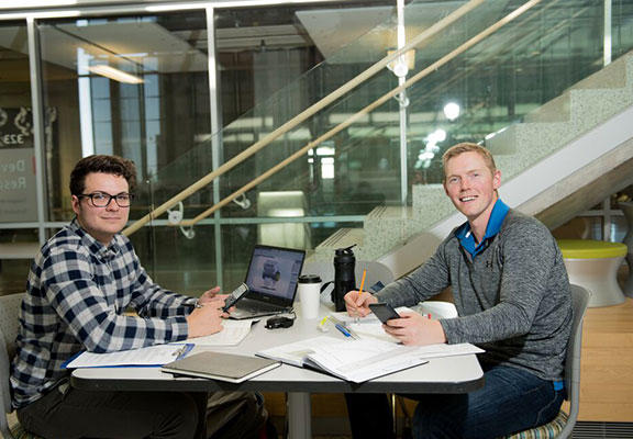From left, energy engineering students Cory Cameron and Mike Waites studying in the Devon Academic Resource Centre at the Schulich School of Engineering.