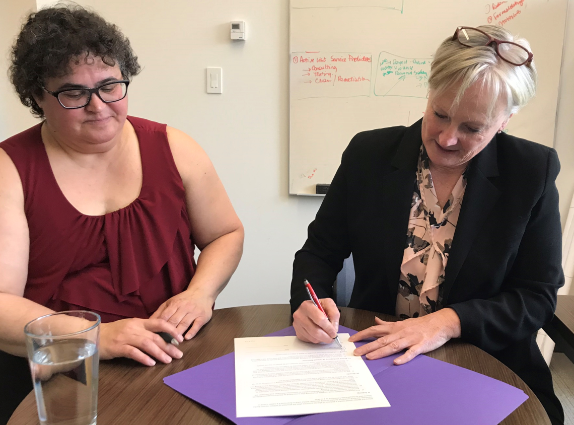 On March 15, Paulette Harrison, AUPE, co-chair, and Rae Ann Aldridge, associate vice-president (risk) and co-chair, officially signed the Terms of Reference of the new JWHSC.