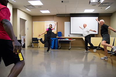 University of Calgary PhD student Lisa Daroux-Cole, from the Faculty of Kinesiology, leads an exercise/yoga class for men recovering from prostate cancer.