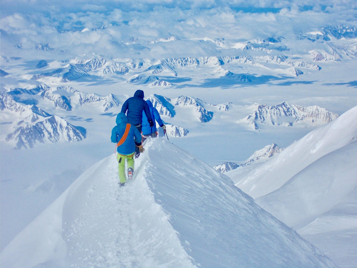 Paul Chiddle descending with two clients from the summit of Mt Logan, the highest peak in Canada.