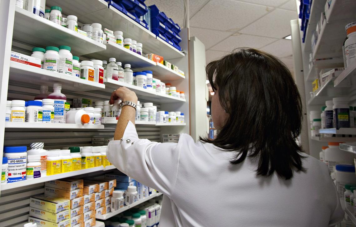 A lab technician prepares a prescription at a pharmacy in Quebec City on March 8, 2020