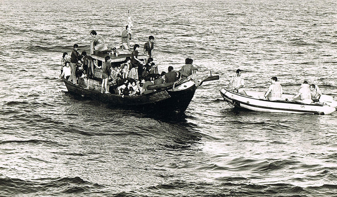 Vietnamese people fleeing their country are seen in a crammed boat off the coast of Vietnam in the late 1970s.