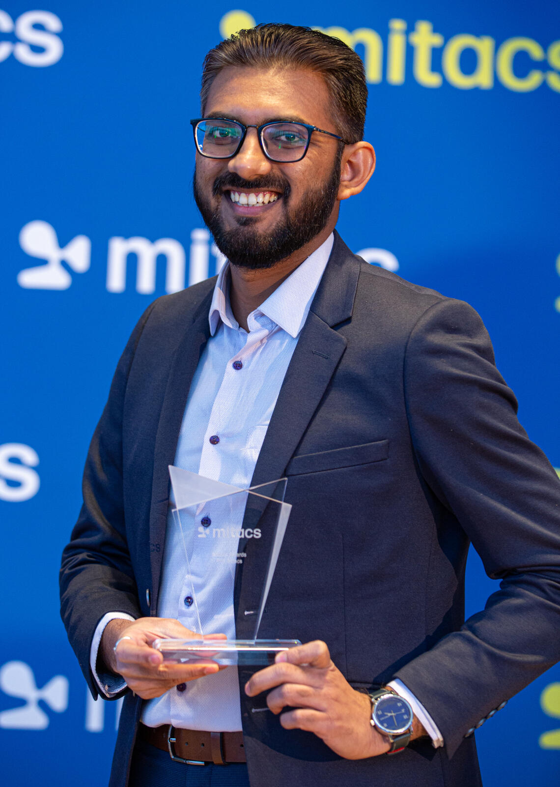 Ketul Patel poses with his Mitacs Award 