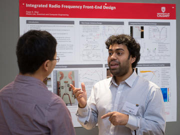 Killam Predoctoral Laureate Sagar Kumar Dhar, Electrical and Computer Engineering (right) discusses his research