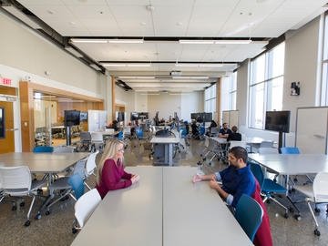 The learning studio on the east side of The Taylor Institute for Teaching and Learning. The room can be subdivided into two spaces, and all of the chairs, tables and screens are on wheels, so they can be arranged in any configuration. 