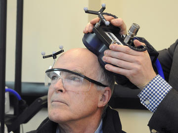 Researchers at the Cumming School of Medicine (CSM) are conducting a study to find out whether transcranial magnetic stimulation, or TMS, can improve thinking or memory function for people living with Parkinson’s disease. Peter Meier, pictured here, volunteered to be a study participant