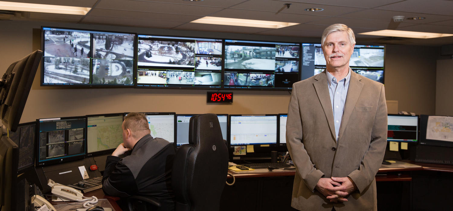 Brian Sembo, chief of campus security, in the Security Operations Centre, where recorded data from more than 1,100 high-resolution digital cameras across campus is monitored. Photo by Riley Brandt, University of Calgary
