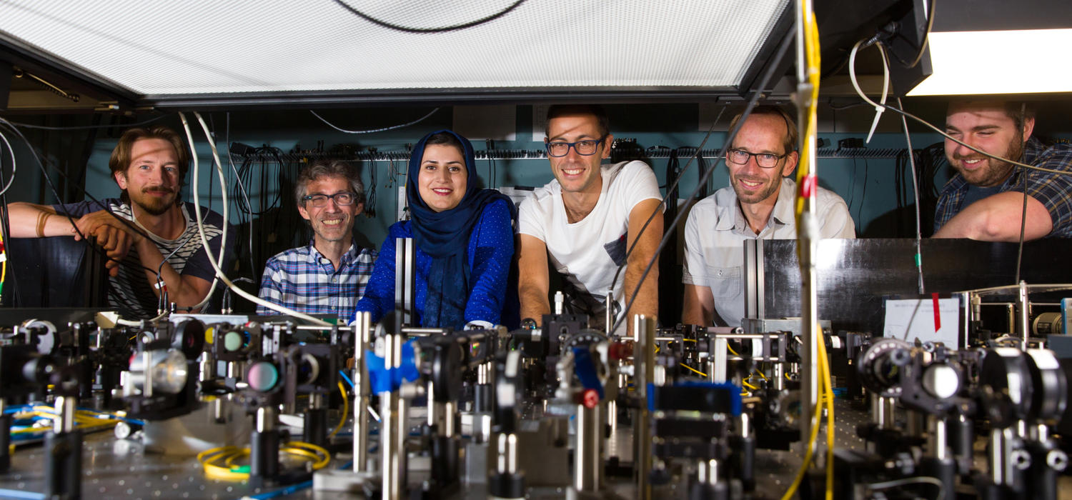 Nine graduate students and post-doctoral researchers from Simon’s and Tittel’s group worked on the experiment. Some of the team, from left: Daniel Oblak, Christoph Simon, Parisa Zarkeshian, Marcel.li Grimau, Wolfgang Tittel, and Pascal Lefebvre. 