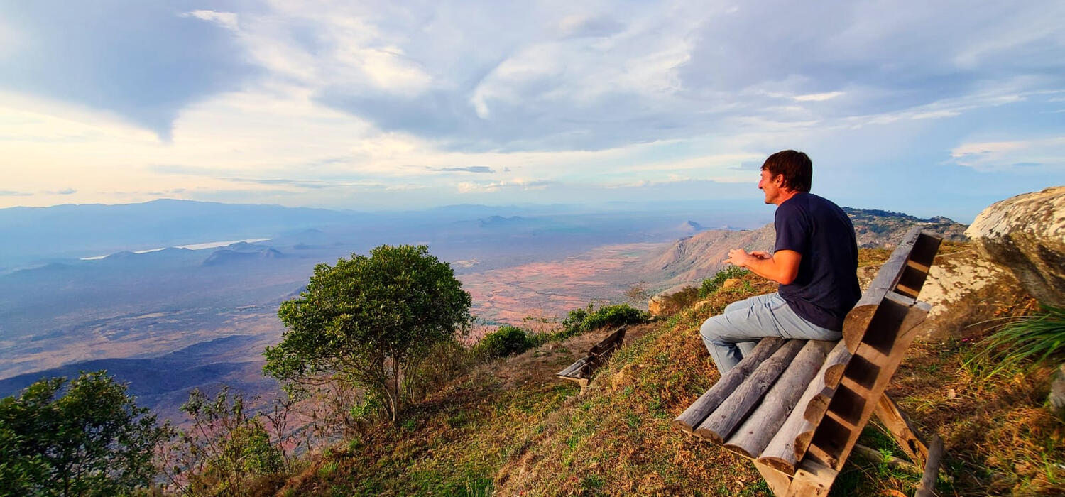 Dr. Jiri Slaby, MD, PhD, takes in a remarkable view from the Mambo View Point looking over the Usambara Mountains in Tanzania last year.