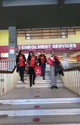 Students (from left) Fariah Thaseen, Dilpreet Samra, Linh Phan and Bala Bhaskar have been delivering Ignitor packages to faculty/staff donors this week. Development and Alumni Engagement photos