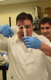 Two people in lab with test tube