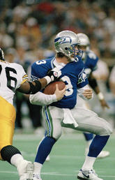 Seattle Seahawks quarterback Rick Mirer (3) is sacked for a seven-yard-loss by Kevin Henry (76) of the Pittsburgh Steelers during the second quarter of their NFL game on Dec. 26, 1993. 
