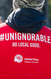 Image of the back of a t-shirt that reads "#Unignorable. Do local good." 