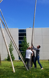 The Office of Indigenous Engagement and other community members build a Tipi