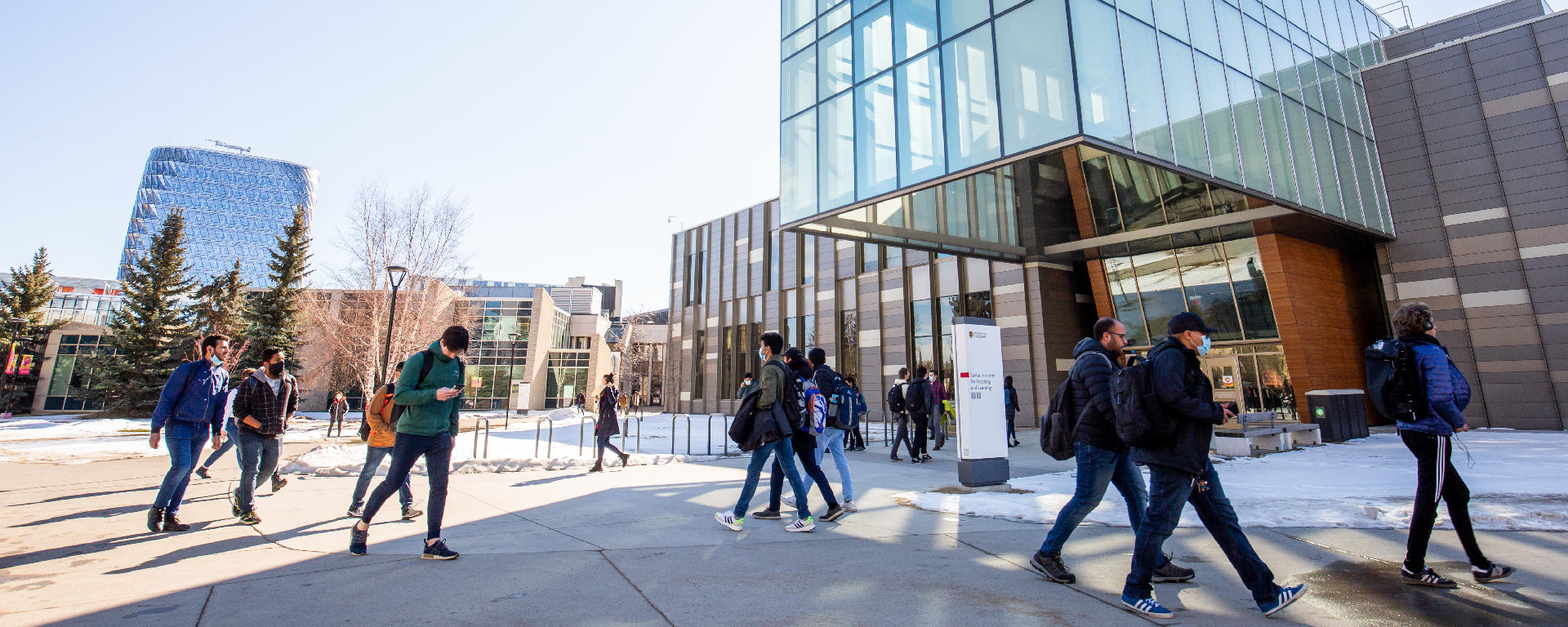 External view of the Taylor Institute for Teaching and Learning building, people walking past on the pathway.