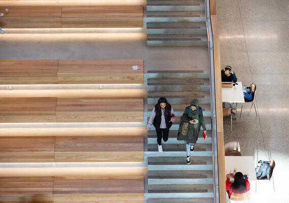 students sitting on the steps at Mathison Hall 