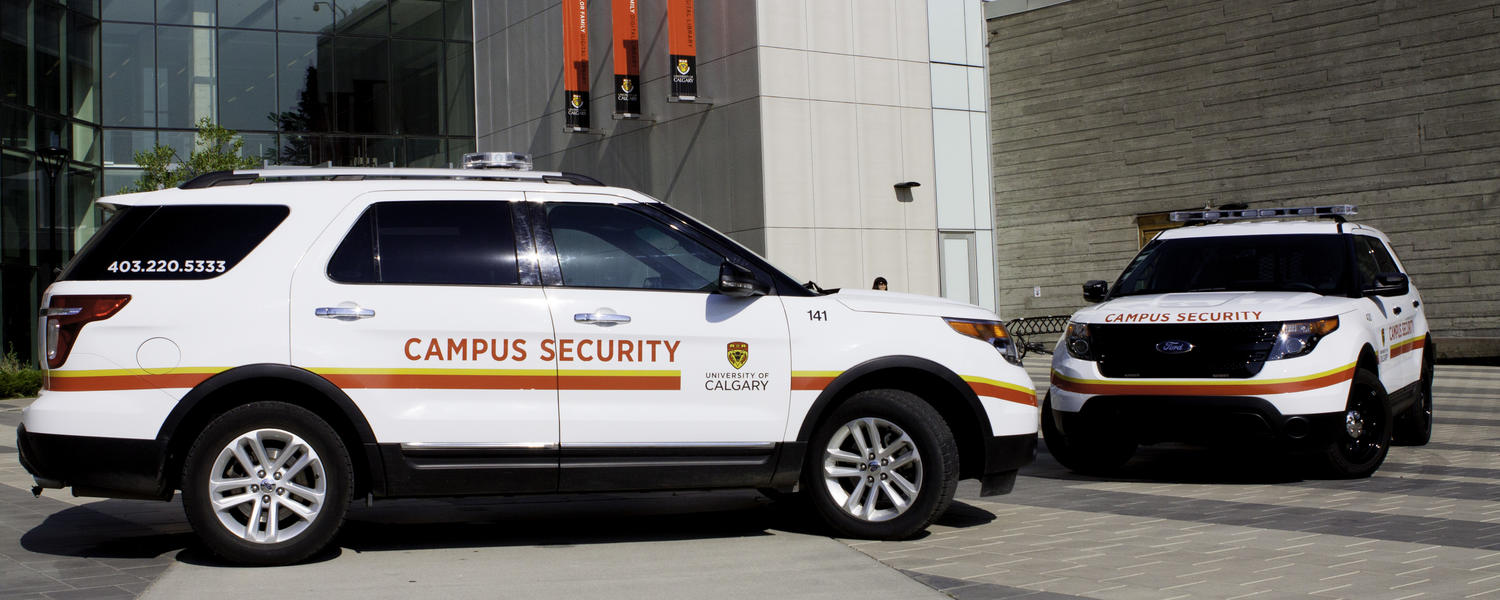 a campus security vehicle parked in front of the Taylor Family Digital Library