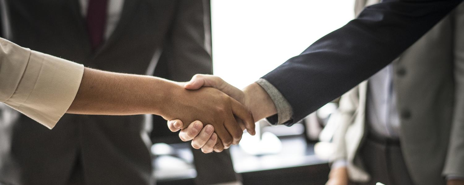 two people shaking hands.