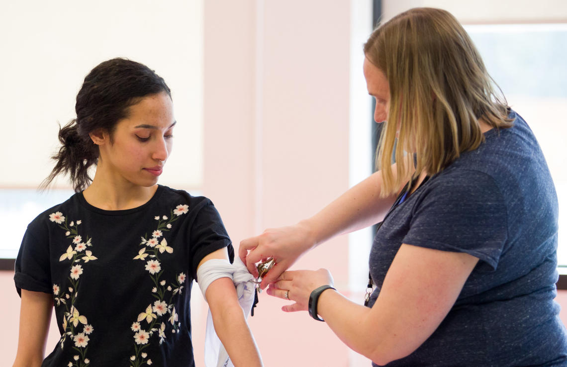 University of Calgary staff learn to use bleeding control kits at the Stop the Bleed training.