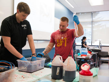 University of Calgary staff learn to use bleeding control kits at the Stop the Bleed training.