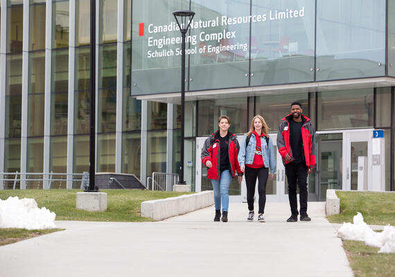 safewalk volunteers walking out of engineering complex 
