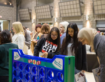 People at an event with board games 