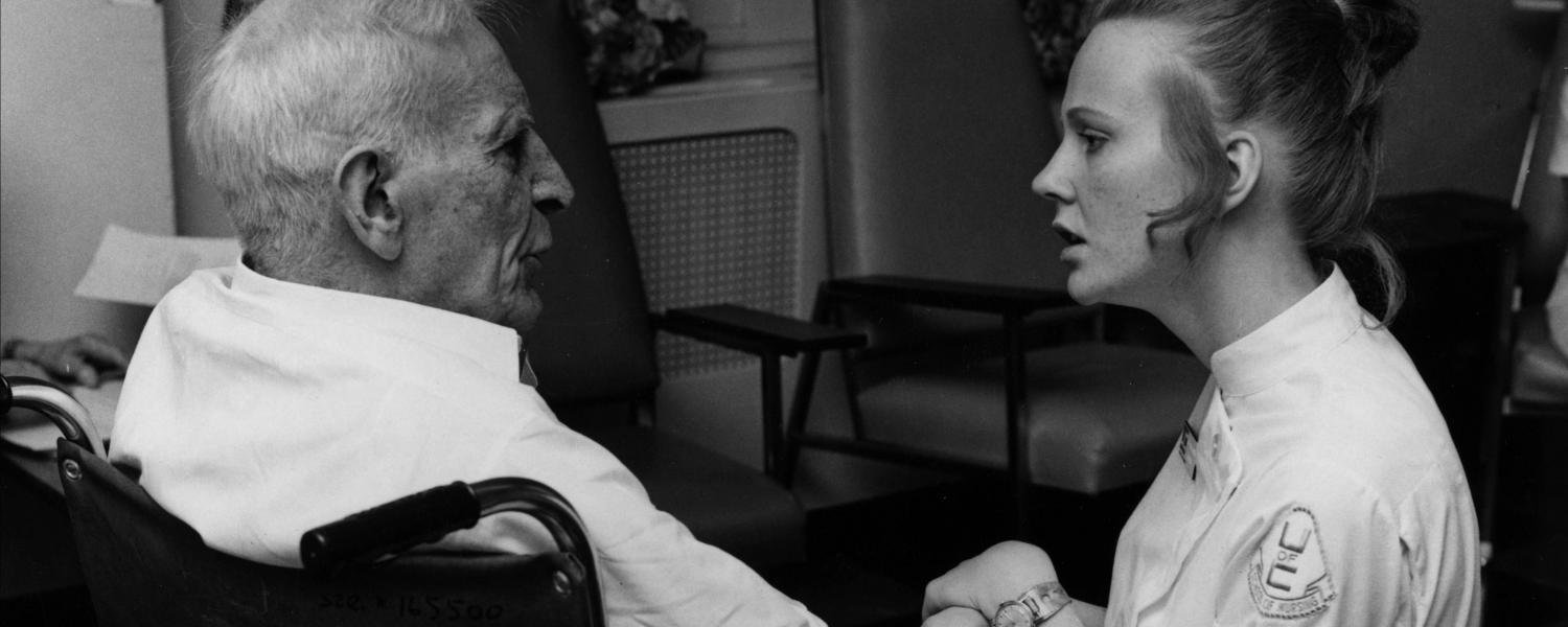 Student nurse with senior citizen in care facility